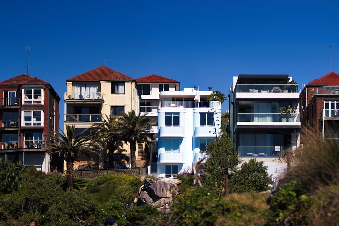Apartment buildings on a sunny day with blue sky.